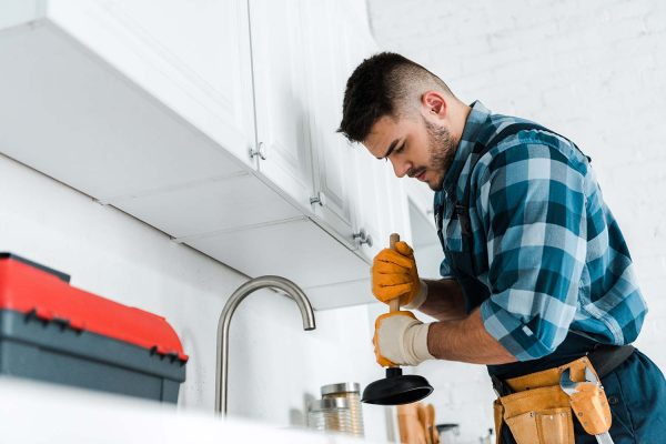 selective-focus-of-repairman-holding-plunger-in-ki-resize.jpg selective-focus-of-repairman-holding-plunger-in-ki-resize.jpg